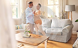 Love, retirement and dance with a senior couple in the living room of their home together for bonding. Marriage, romance