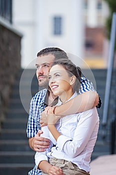 Love, Romance and Care Concepts. Closeup Portrait of Loving Caucasian Couple Traveling Around City. Posing Embraced Together