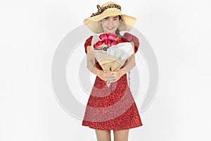 Love and romance on Valentines day. Beauty young Asian woman in red dress holding bouquet of roses over white isolated background