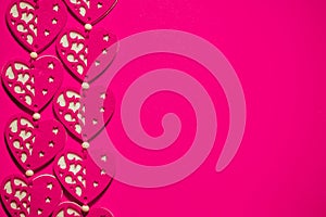 Love, romance, Valentines Day concept, toned felt fabric hearts design on contrasting hot pink background, ample copy space