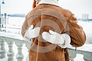 Love romantic couple lovestory. Brutal bearded man, bright red-haired girl woman in winter park. Romantic date, kissing photo