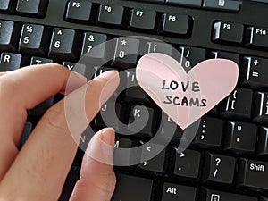 Love Scam awareness concept. A person tricked by online romance scammer