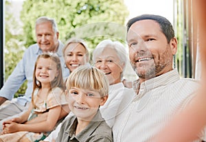 Love, selfie and a big family on a sofa in the living room of their home together during a visit. Portrait, photograph