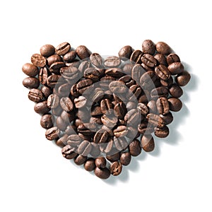 Love sign with coffee beans arranged Heart shape over white background