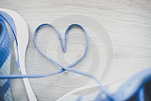 Love sign, Selective focus close up blue sport shoes