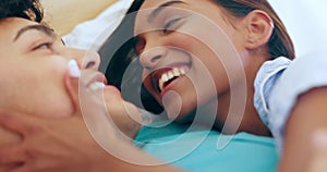 Love, smile and couple in bed with happy, conversation and relax while bonding in their home together. Smile, face and