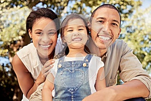 Love, smile and happy family portrait outdoor in a forest, park or woods with hug, bonding and care. Latino woman, man