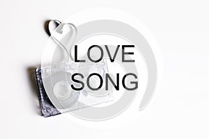 Love song background om audio cassette tape shape heart
