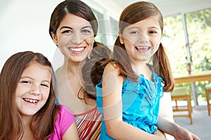 We love spending time with mom. Portrait of a pretty young mother spending time with her two cute daughters.