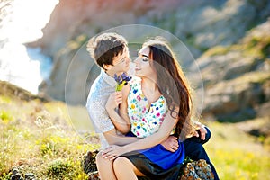 Love story, portrait of young couple. Beautiful young loving couple hugging in nature. The concept of good mood