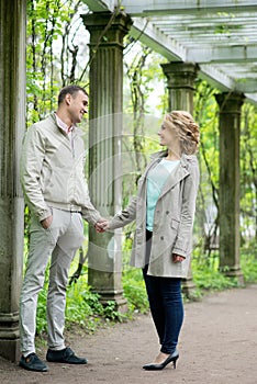 Love story. Romantic couple in relationship in park, garden. Autumn