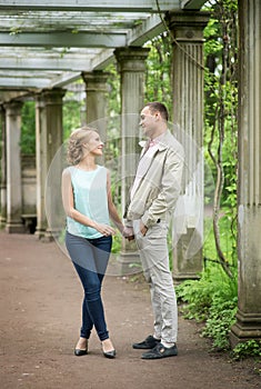 Love story. Romantic couple in relationship in park, garden. Autumn