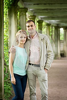 Love story. Romantic couple in relationship in park, garden. Autumn