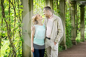 Love story. Romantic couple in relationship in park, garden. Autumn