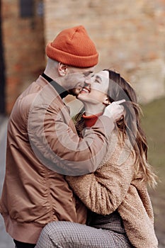 In love stylish young couple kissing in the city. Fashion outdoor sensual romantic portrait of beautiful young couple
