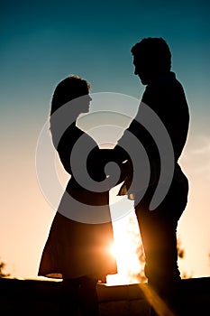 Love - sunset couple embracing each other