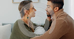 Love, support and happy with a couple in their home together, sharing an intimate moment with a kiss. Smile, talking and