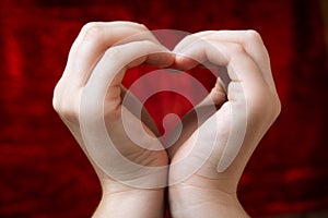 Love symbol in hands