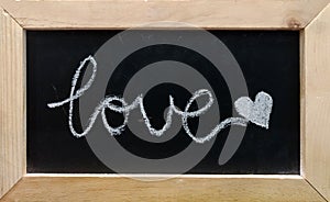 Love text on black board background