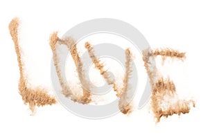 LOVE Text Word of Sand letter. Calligraphy of Sand flying explosion with LOVE text wording in alphabet english letter. White