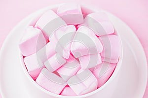 Love theme. Pink marshmallow hearts in a cup. Valentine`s day background. Copy space