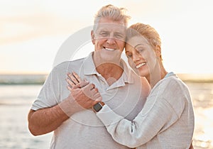 Love, travel and beach portrait with senior couple hug, bond and relax at sunset, happy and cheerful in nature. Smile