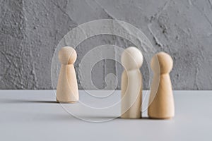 Love triangle concept. One wooden men and two woman. Divorce. Treason.