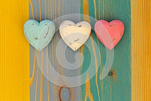 Love Valentine's Hearts on Wooden Texture Painted Board Backgrou