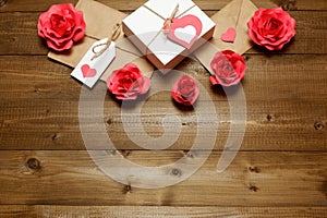 Love, Valentine`s, women`s day, relations, romantic template with gifts and envelope, wrapped in brown craft paper, tied with