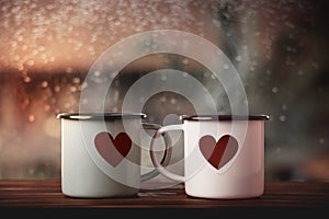 Love and Valentines Day Concept. Couple of Coffee Cup with a Heart Shape by Glass Window in House. Happiness, Romantic or Positive
