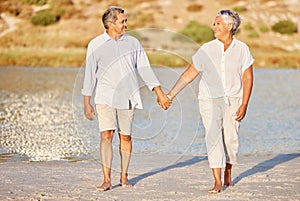 Love, walking and senior couple on a beach lake together for calm, relax and romantic ocean, water or sea date. Elderly