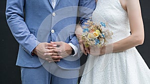 Love wedding couple,Wedding bouquet in hands of bride and groom