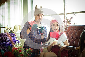 love, wedding, winter, dating and people concept - smiling couple in coffee Time.