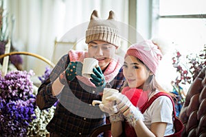 love, wedding, winter, dating and people concept - smiling couple in coffee Time.