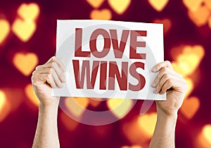 Love Wins card with bokeh background photo