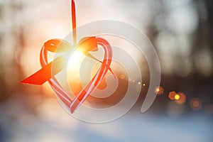 Love in winter. Heart shaped symbol Valentine Day. heart with hands, Feelings and Lifestyle concept on the sunset light