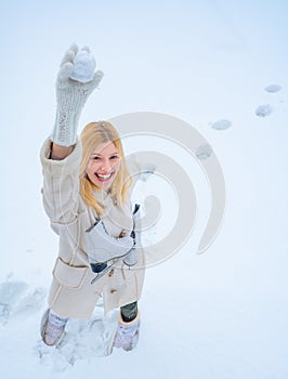 Love winter. Snowing snow winter concept. Enjoying nature wintertime. Christmas. Happy young woman walking in winter