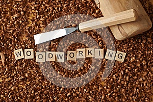 Love woodworking word writen with letters on wood chips with a c