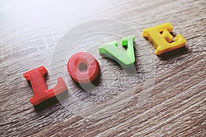 `love` word Close-up shot with a selective focus of the colorful magnetic letters for Valentine`s Day