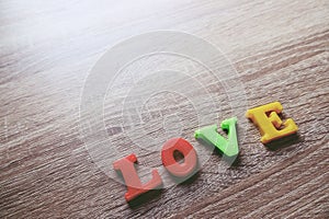 `love` word Close-up shot with a selective focus of the colorful magnetic letters for Valentine`s Day