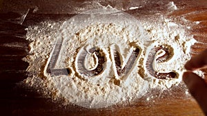 Love word and the heart on flour