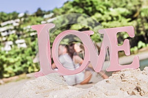 Love word on natural tropical background