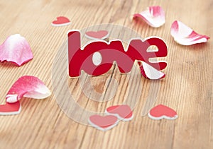 Love word and rose petal