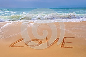 Love written on the sand of a beach, Valentines day