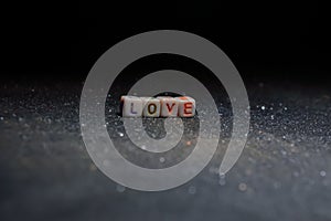 love written text on black background,colorful love text