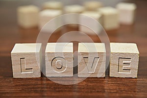 Love written on wooden cube