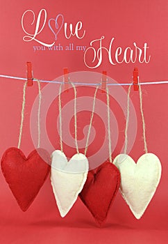 Love you with all my Heart message with red and cream hearts hanging from pegs on a line