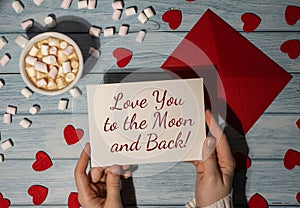 LOVE YOU TO THE MOON AND BACK text on valentine card inscription positive quote, motivation and inspiration phrase