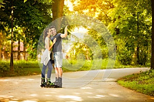 Love young couple on rollerblades