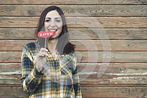 Love,young woman holding a lollipop in his mouth